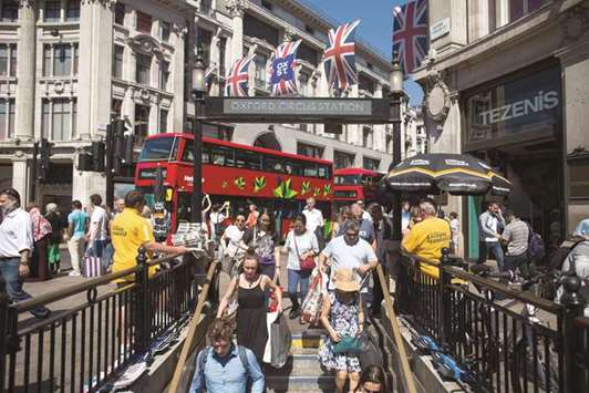 Pedestrians and commuters enter Oxford Circus Underground station in London. The government received a boost yesterday as a group of pro-Brexit economists estimated that leaving the EU single market and customs union could add u00a3135bn to the UK economy and lower prices by opening up global free trade and spurring competition.