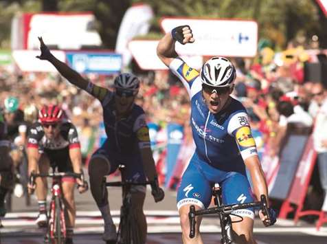 Quick-Step Floors teamu2019s Yves Lampaert (right) celebrates as he crosses the finish line to win the second stage of the Vuelta a Espana in Gruissan, France, yesterday. (AFP)
