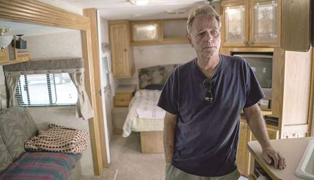 Raymond Taylor looks around his temporary trailer home for the year after the Erskine wildfire as he prepares to move into his new home.