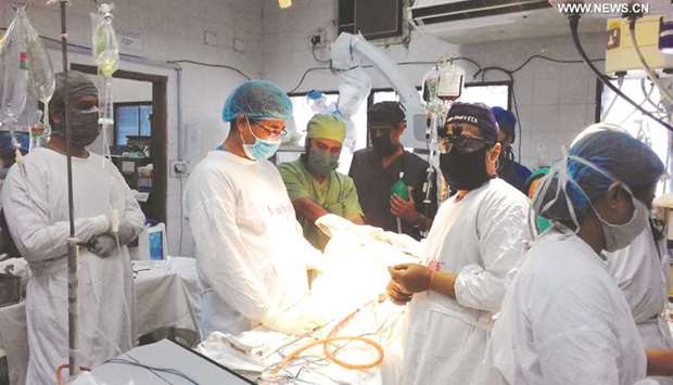 Dhaka Medical College and Hospital surgeons operate on conjoined twins in Dhaka yesterday.