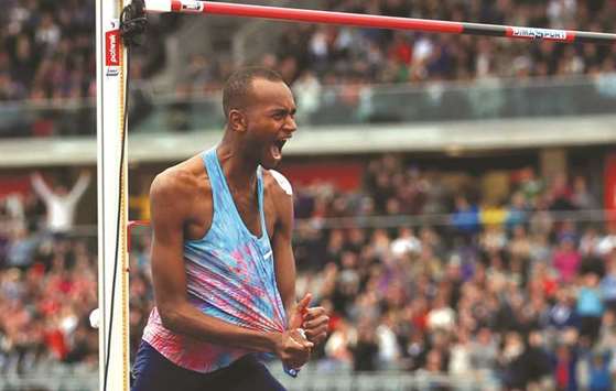Qataru2019s Mutaz Essa Barshim celebrates after clearing the 2.40m mark in the menu2019s high jump event at the Diamond League meet in Birmingham yesterday. (Reuters)