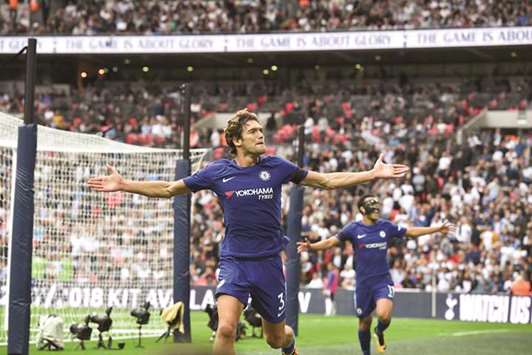 Chelseau2019s Marcos Alonso (left) celebrates scoring their second goal during the English Premier League match against Tottenham Hotspur at Wembley Stadium in London yesterday. (AFP)
