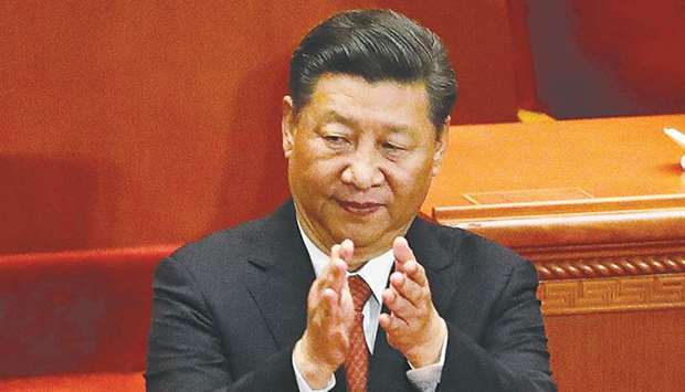 Chinau2019s President Xi Jinping applauds during a ceremony to commemorate the 90th anniversary of the founding of the Peopleu2019s Liberation Army, at the Great Hall of the People in Beijing yesterday.
