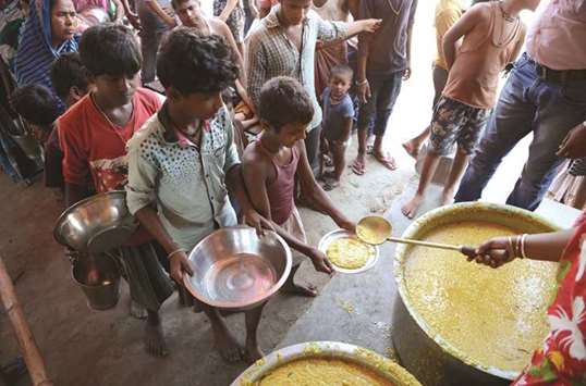 Villagers queue for food at the flood-hit Dagrua village in Bihar.