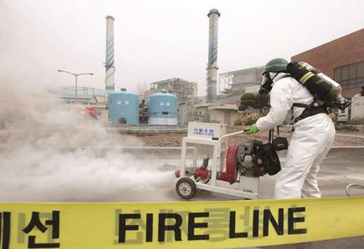 A South Korean firefighter in chemical suit participates in a training for chemical accidents in a thermal power plant.