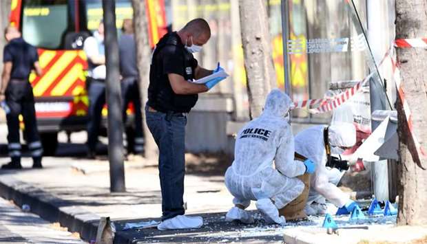 French forensic police search the site following a car crash in Marseille