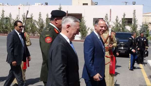 US Defense Secretary James Mattis (C-L) walks with Jordan's Prince Faisal (C-R), the brother of King Abdullah II, as he is welcomed and escorted to his meeting with the King in Amman.
