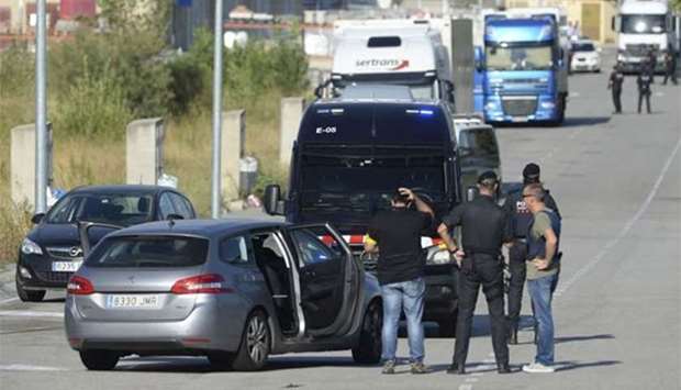 Spanish policemen control the road to the site where Moroccan suspect Younes Abouyaaqoub was shot on Monday near Sant Sadurni d'Anoia, south of Barcelona.