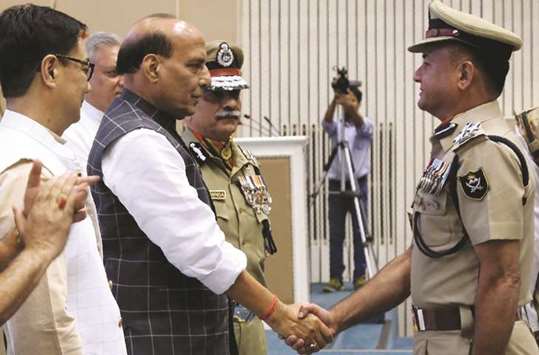 Home Affairs minister Rajnath Singh greets newly-promoted officials of the Indo-Tibetan Border Pratrol (ITBP) during an event in New Delhi yesterday.