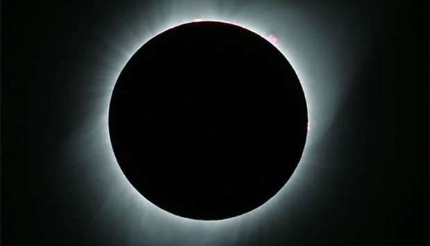 The sun is in full eclipse over Grand Teton National Park outside Jackson, Wyoming on Monday.