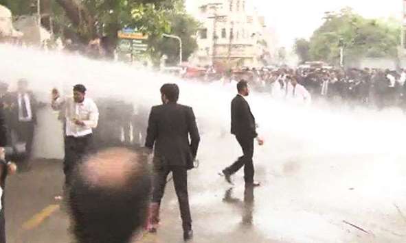Police fire water cannon at protesting lawyers in Lahore.