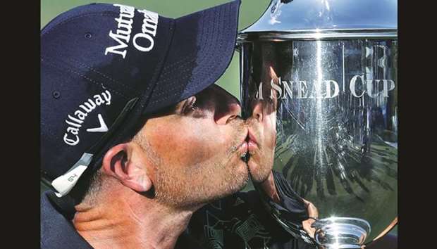 Henrik Stenson kisses the trophy after winning the Wyndham Championship at Sedgefield Country Club in Greensboro, North Carolina.