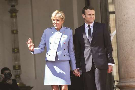 This file photo taken on May 14 shows the Macrons at the Elysee presidential palace in Paris.