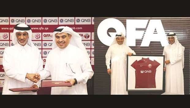 QFA president Sheikh Hamad bin Khalifa bin Ahmed al-Thani (left) and QNB Group CEO Ali Ahmed al-Kuwari during the signing event. Picture at right shows them posing with a football jersey.