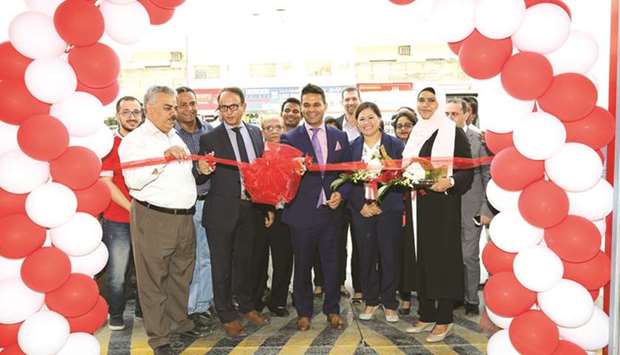 Officials from Aamal Trading and Distribution and Bridgestone Middle East open the second u2018First Stopu2019 tyre and auto service centre in Doha.