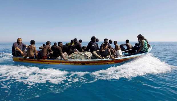 Migrants ride in a boat after they were rescued by Libyan coastguard off the coast of Gharaboli, east of Tripoli, Libya. File picture:  July 8, 2017