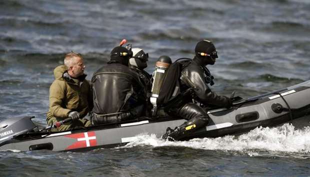 Divers from the Danish Defence Command preparing for a dive in Koge Bugt near Amager in Copenhagen on August 22, 2017 where a woman torso was found yesterday.