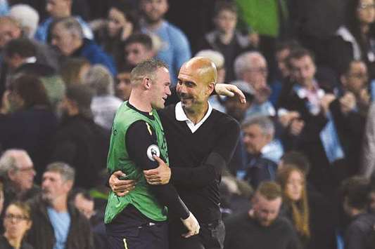 Manchester City manager Pep Guardiola (left) congratulates Evertonu2019s Wayne Rooney after the Premier League match in Manchester. (AFP)