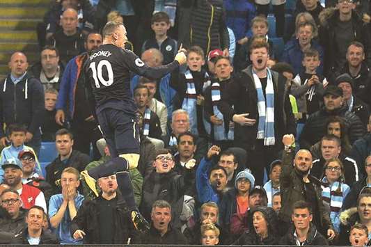 Evertonu2019s English striker Wayne Rooney celebrates scoring his teamu2019s goal during the English Premier League football match between Manchester City and Everton at the Etihad Stadium in Manchester, north west England, on Monday.
