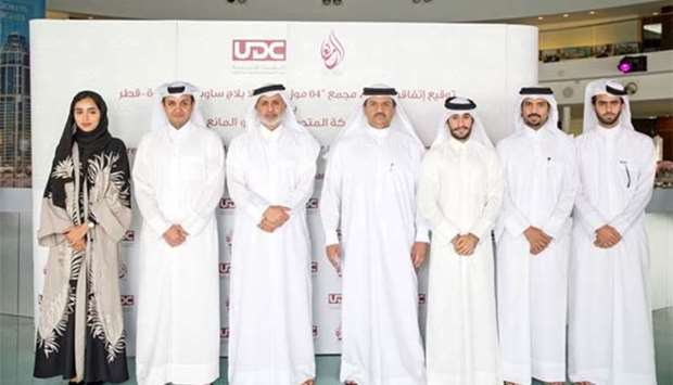 Turki bin Mohamed al-Khater, chairman of UDC, along with Ibrahim Jassim al-Othman, president and CEO of UDC, Abdulaziz Mohamed Hamad al-Mana, CEO of Mohammed Al Hamad Al Mana Group, and others.