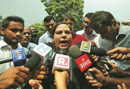 Farha Faiz, a lawyer, speaks with the media after the Supreme Court delivered its verdict in New Delhi yesterday.