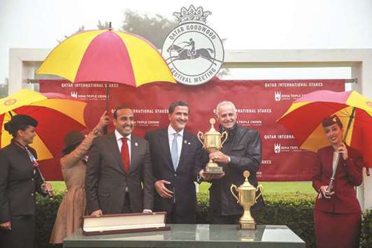 Trainer Alban de Mieulle (second from right) receives the trophy from Qataru2019s ambassador to the UK Yousef Ali al-Khater (third from right) in the presence of QREC chairman Issa bin Mohamed al-Mohannadi after Tayf, owned by His Highness Sheikh Abdullah bin Khalifa al-Thani, won the Qatar International Stakes (Gr1PA) at the Qatar Goodwood Festival yesterday. PICTURE: Juhaim