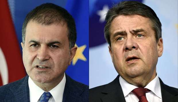 Turkey's minister for EU Affairs of Turkey Omer Celik (L) giving a press conference at the EU headquarters in Brussels on July 25, 2017 and German Minister of Foreign Affairs Sigmar Gabriel speaking during a joint press conference on April 5, 2017 at the EU headquarters in Brussels.