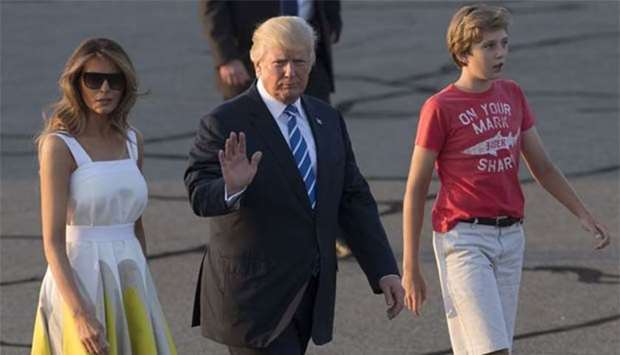 US President Donald Trump, First Lady Melania Trump and their son Barron walk to board Air Force One prior to departure from Morristown, New Jersey this week.