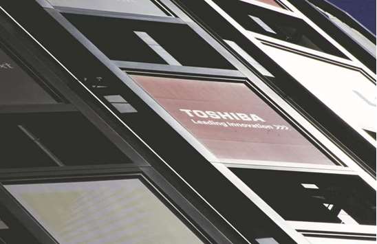 A logo of Toshiba is seen outside an electronics retail store in Tokyo. Sources told Reuters that Toshiba had begun talks with Western Digital as well as Taiwanu2019s Foxconn in an attempt to revive the stalled auction process.