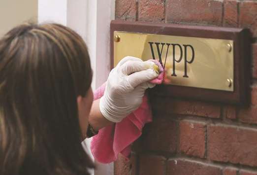 A company plaque is cleaned outside the offices of WPP in London. The British advertising giant has downgraded its growth forecast for 2017 because of a slowdown in the market, causing a fall of over 10% in the companyu2019s stock price yesterday.