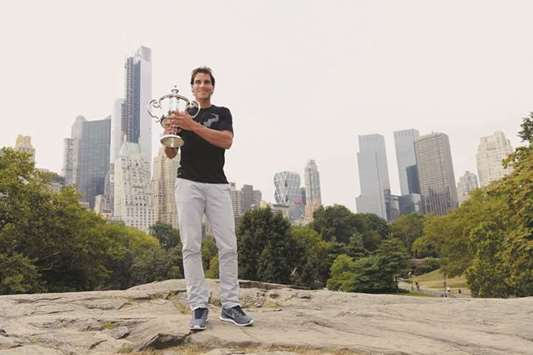 This file photo taken on September 10, 2013 shows Rafael Nadal of Spain with the US Open trophy. Their rivalry has stretched 13 years and 37 matches but Nadal and Roger  Federer have never met at the US Open, a staggering anomaly which seems certain to be corrected at 2017u2019s concluding Grand Slam, starting on August 28.