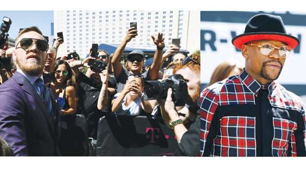 Thousands of fans including a sizeable contingent of Irish supporters thronged the heart of the Nevada boxing capital in Las Vegas to greet UFC lightweight champion Conor McGregor and Floyd Mayweather Jr. (top right) at their separate grand arrival ceremonies on Tuesday. (AFP)