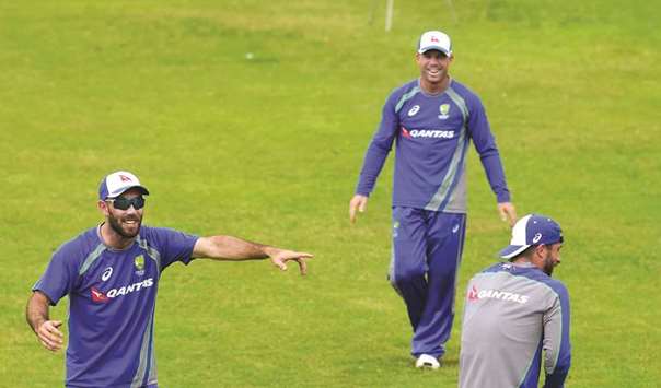 Australian cricketer Glenn Maxwell (left) shares a light moment with teammates during a training session in Dhaka. (AFP)