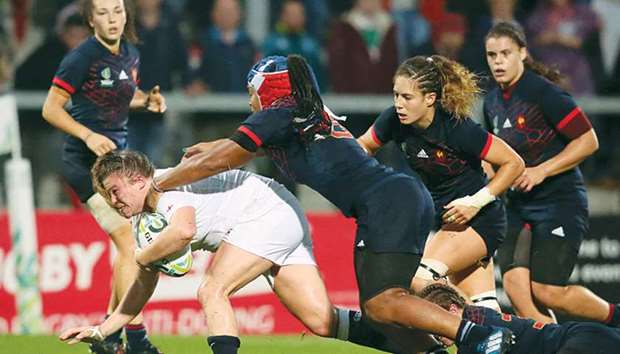 Englandu2019s Sarah Bern (left) is tackled by Franceu2019s Safi Nu2019Diaye during the Womenu2019s Rugby World Cup 2017 semi-final match in Belfast on Tuesday. (AFP)