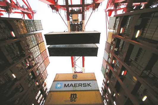 Containers are seen unloaded from the Maersku2019s Triple-E giant ship at the Yangshan Deep Water Port in Shanghai. Chinau2019s imports from North Korea were $156mn, down 3% from last month and a third lower than a year ago, based on data on the customs website.