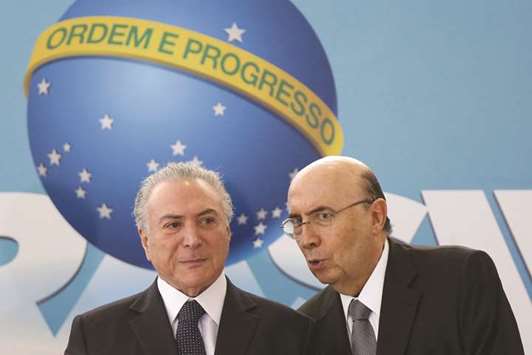Brazilu2019s President Michel Temer with Brazilu2019s Finance Minister Henrique Meirelles at the Planalto Palace in Brasilia yesterday.