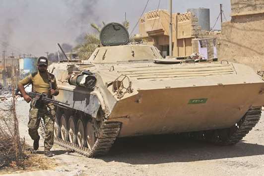 Iraqi forces advance inside the Al Nour neighbourhood in eastern Tal Afar.