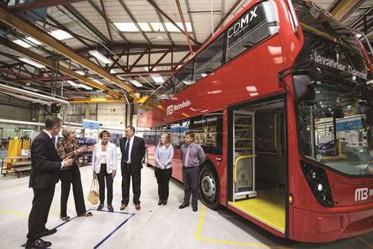 May on her tour of the Alexander Dennis bus and coach manufacturers factory in Guildford, south of London.