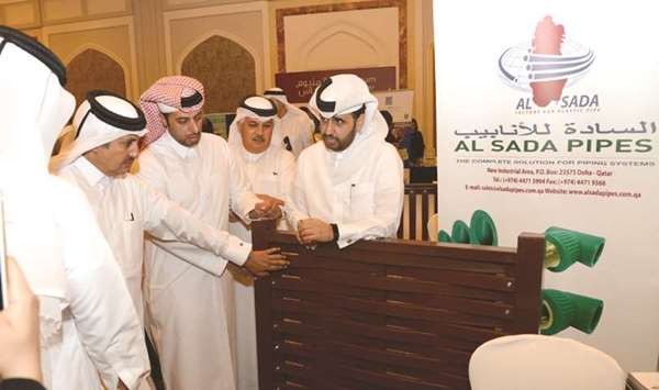 QDB CEO Abdulaziz bin Nasser al-Khalifa and Qatar Chamber chairman HE Sheikh Khalifa bin Jassim al-Thani inspect some of the products on display at the u2018Buy Local Productsu2019 event organised by QDB last month.