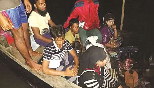 Rohingya refugees fleeing from Myanmar after Bangladesh coast guard stopped them on the Naf river.