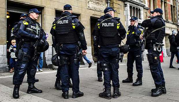 Dutch police officers patrol at the Central Station in Amsterdam