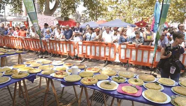 EGGY: Tortilla patatas (omelettes made with eggs and potatoes) are displayed during a culinary competition at the Aste Nagusia fiesta in Bilbao, Spain this week.