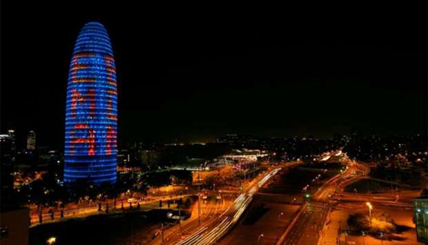 The Agbar tower is illuminated with ,EMA BCN, presenting their candidature to move the European Medicines Agency (EMA) to Barcelona after Brexit