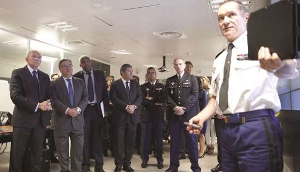 French Interior Minister Collomb (left) and his Spanish counterpart Ignacio Zoido visit the command centre at the headquarters of the French Gendarmerie in Issy-les-Moulineaux, outside Paris.