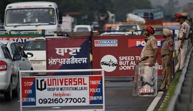 Indian security forces stand guard in Panchkula, near Chandigarh, on Thursday.