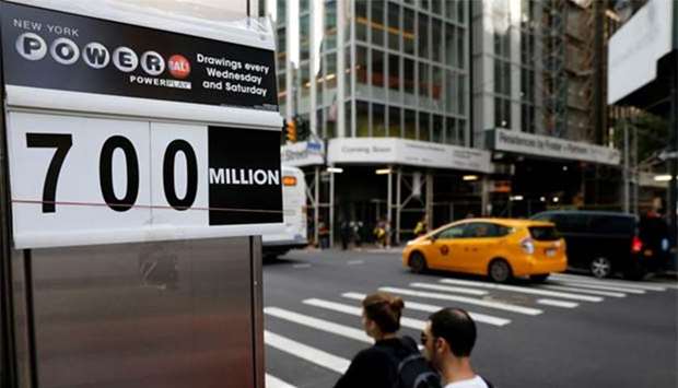 A sign displays the Powerball jackpot at a newsstand in New York City.