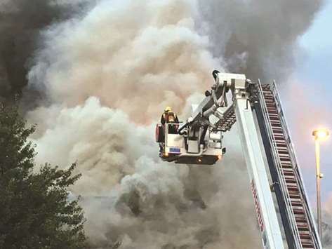 Firefighters battle a fire at a department store in Chingford, London.