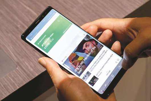 A guest uses a new Galaxy Note 8 smartphone during the  companyu2019s launch event in New York City on Wednesday.