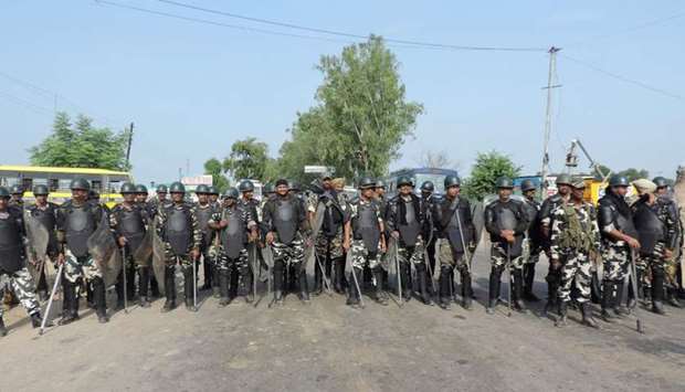 Indian police in riot gear gather to confront followers of Gurmeet Ram Rahim Singh, the controversial head of religious sect Dera Sacha Sauda (DSS), in his home base town of Sirsa.