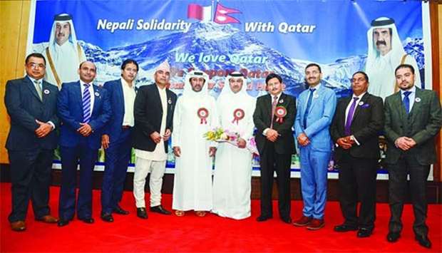 Rashid al-Dehaimi, assistant director of Asian Department at Qataru2019s Ministry of Foreign Affairs, and Fahad Saleem Almarri, from the Asian Department, are seen with the Nepalese community leaders at the solidarity event.